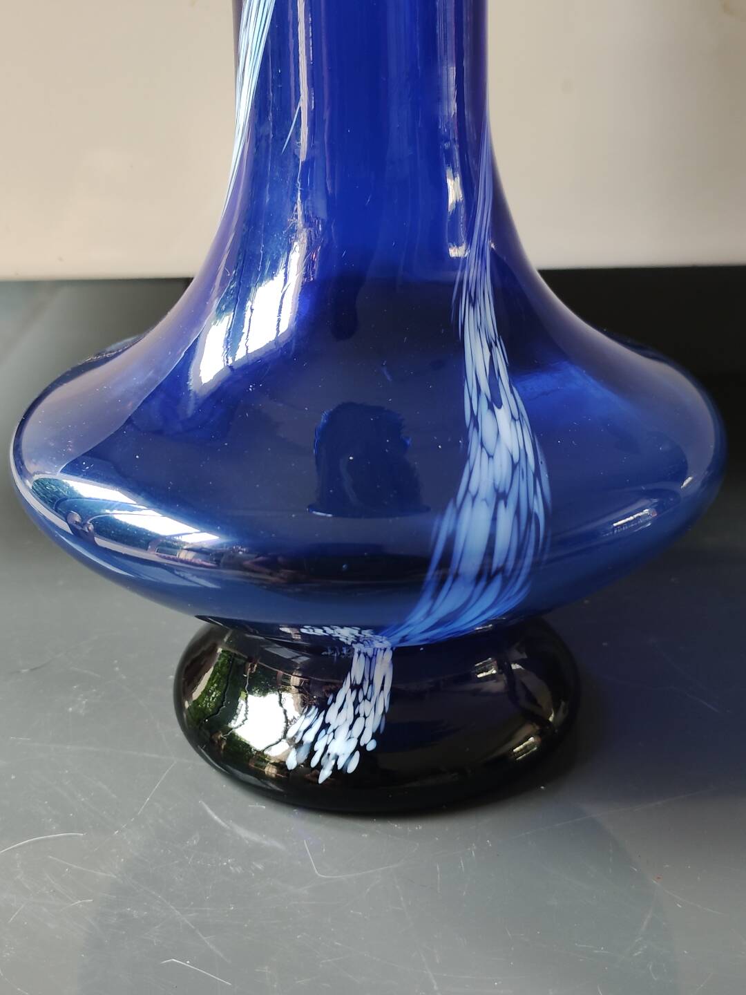 Long flared neck ball vase. Smoked scrolls in cobalt blue art glass, 30cm