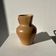 Small pitcher in light beige sandstone