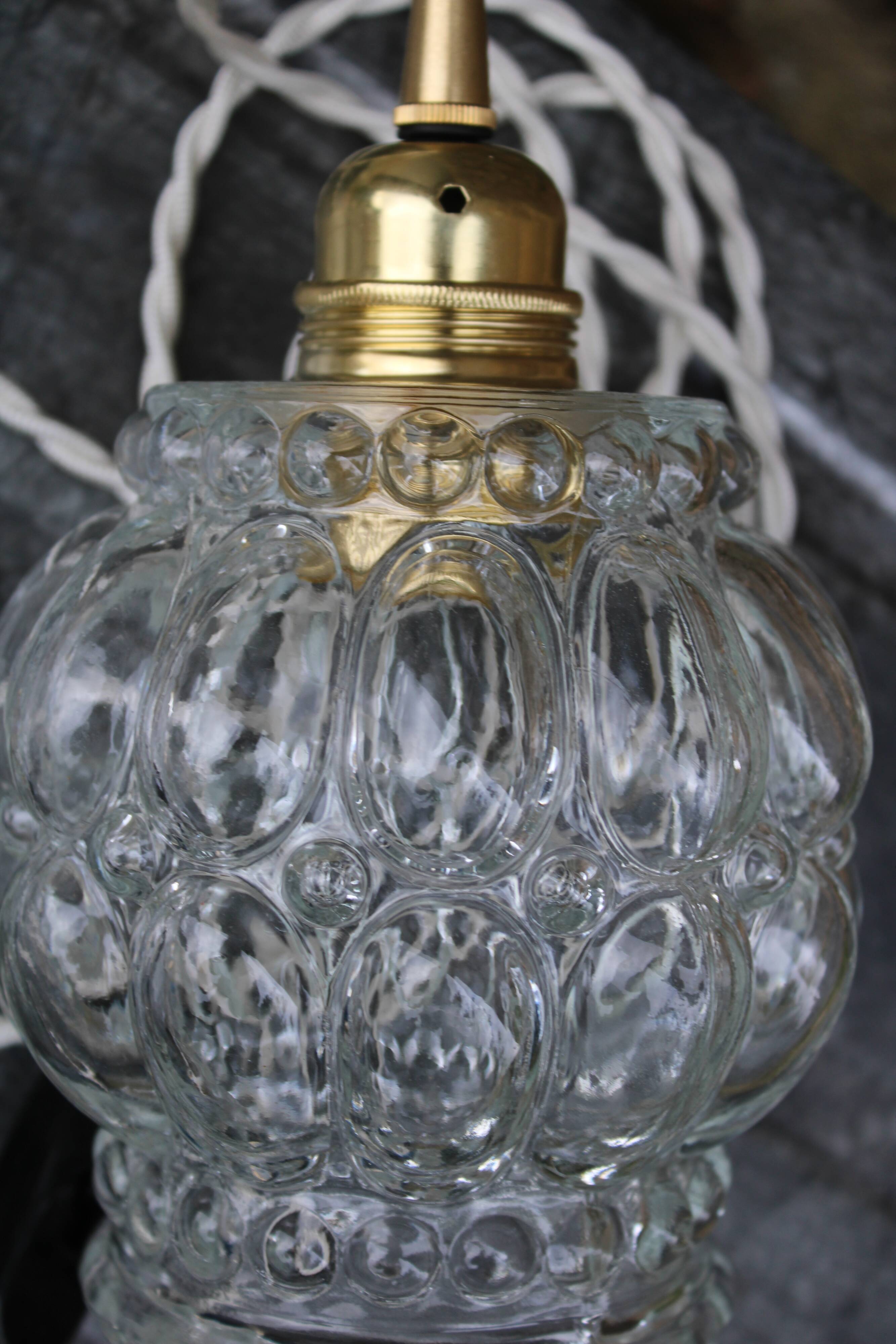 Moulded glass globe hand lamp