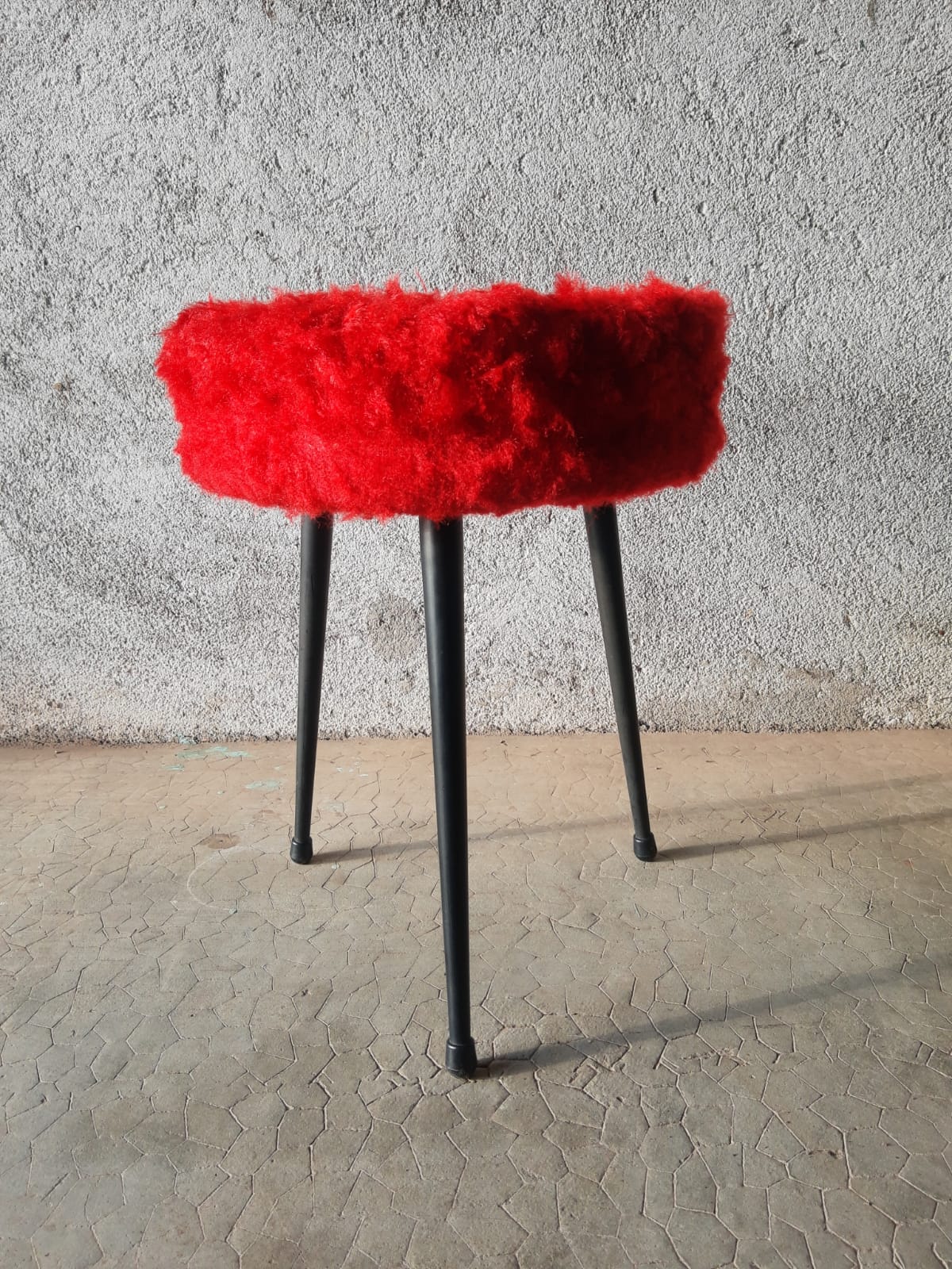 Tripod stool with vintage red moumoute seat