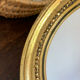 Miroir rond en bois de couleur dorée