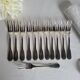 12 Christofle Versailles model cake forks in silver-plated metal.