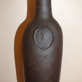 Old terracotta bottle with small spout