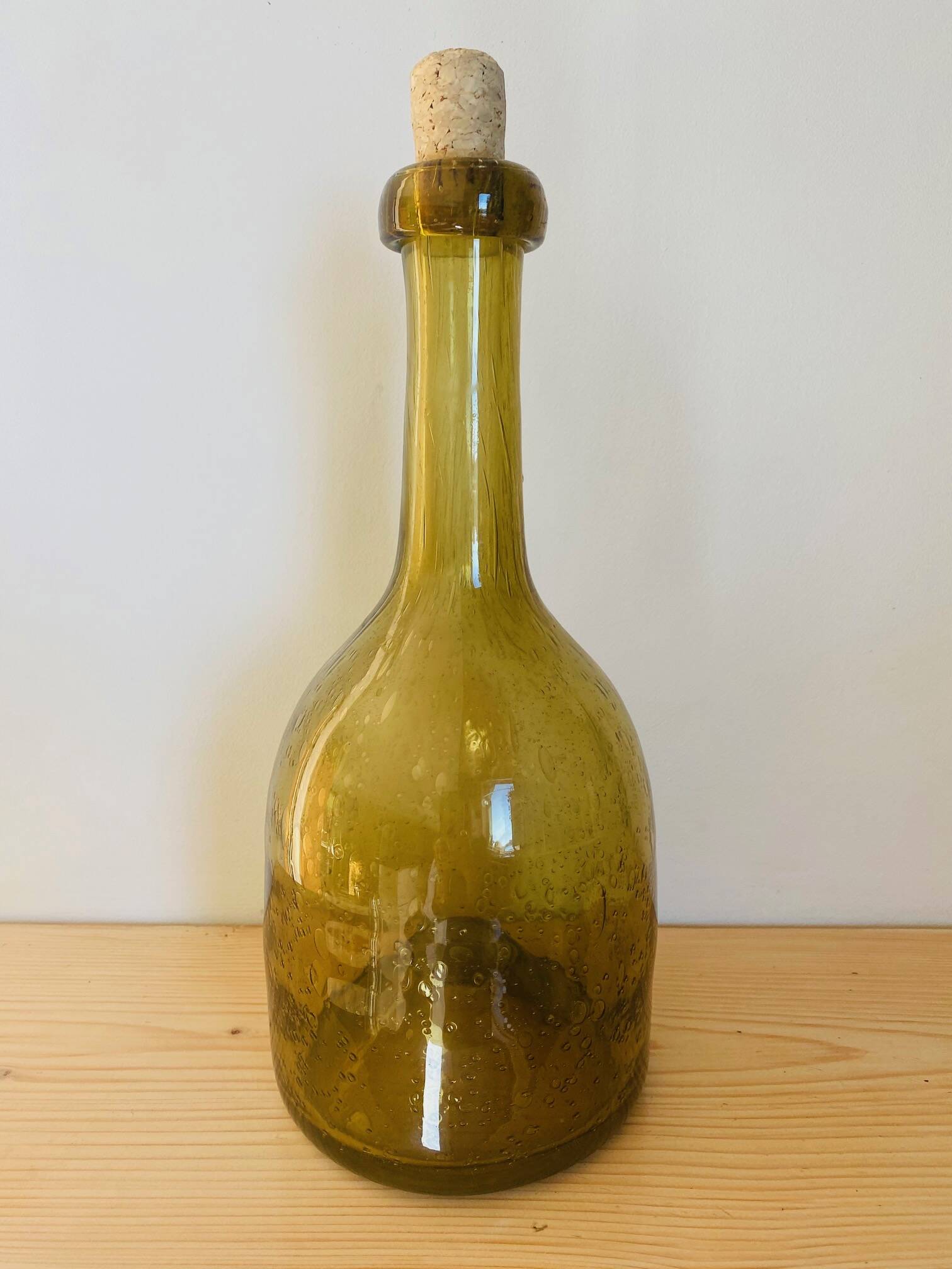 Amber colored Biot bubble glass bottle