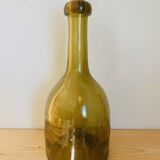 Amber colored Biot bubble glass bottle