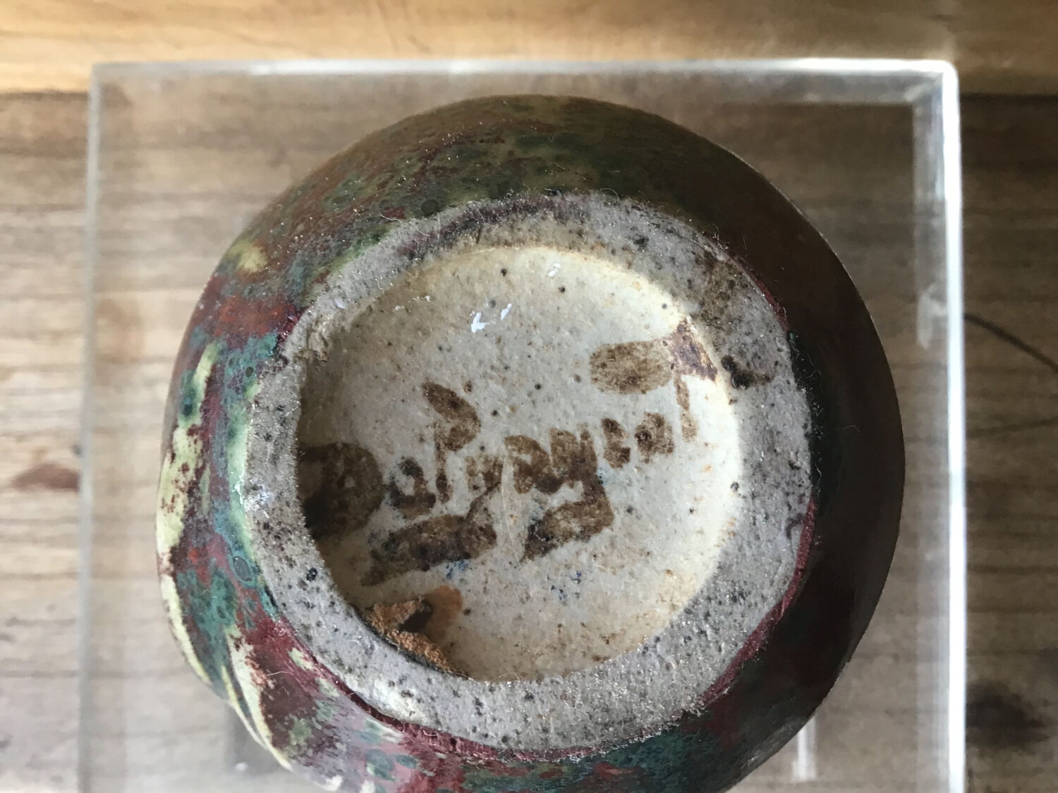 Small Dalpayrat vase shaped ball in polychrome glacured ceramic with relief decoration of a flower signed under the base