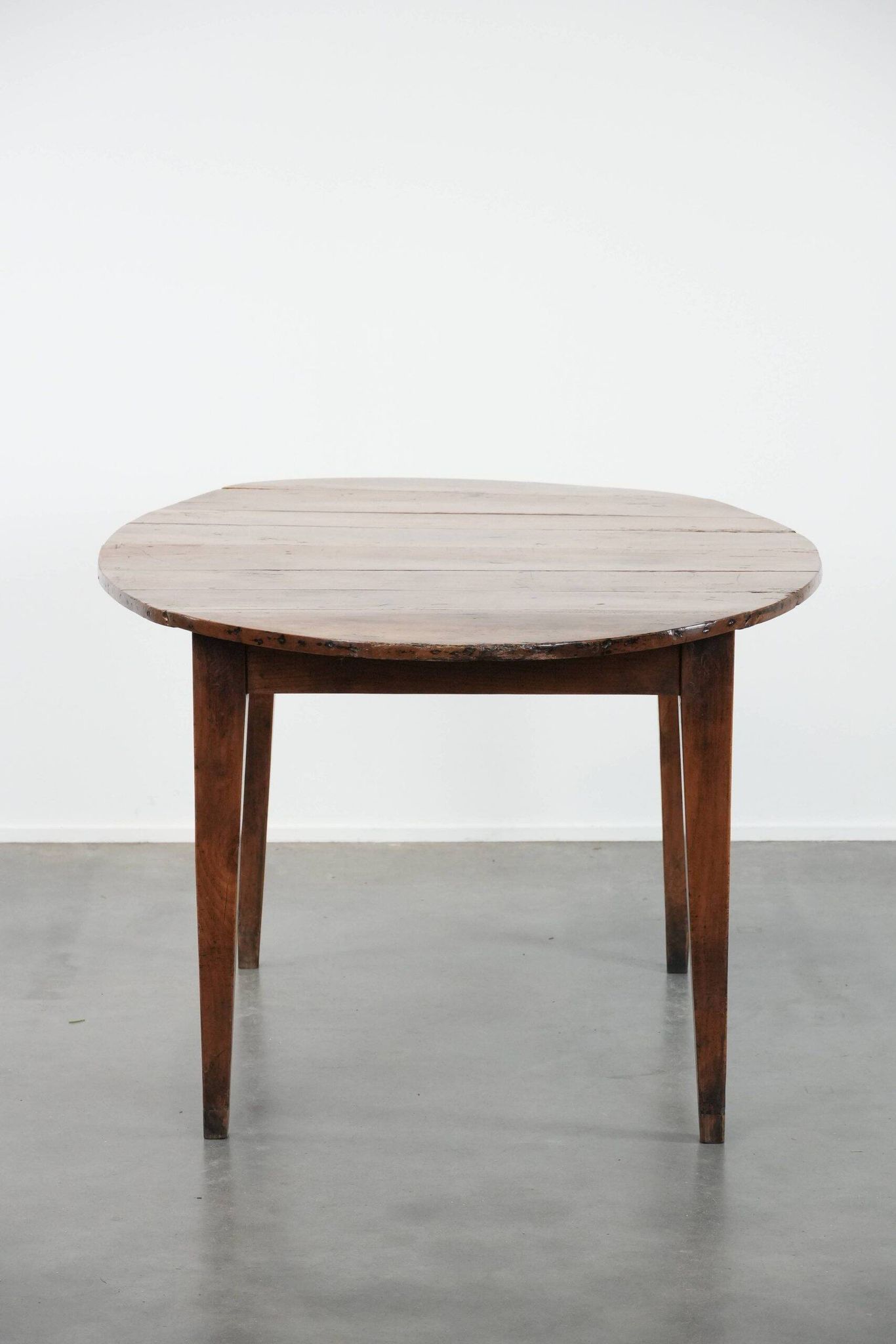 Rare antique oval French extendable dining table made of fruitwood