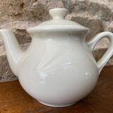 Small light beige earthenware teapot