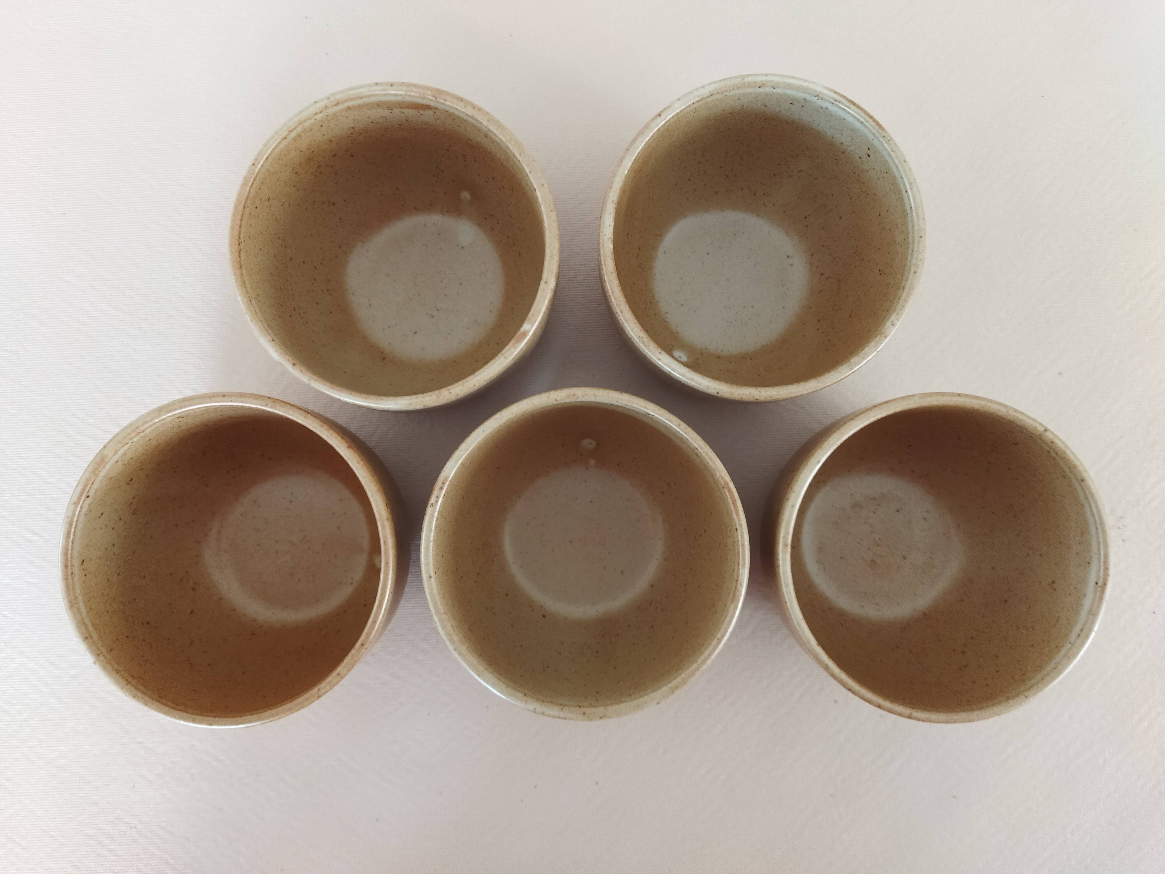 Covered tea bowls in CNP Village sandstone