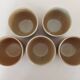 Covered tea bowls in CNP Village sandstone
