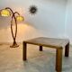 Old coffee table with golden marble top, 70s design, vintage wooden feet
