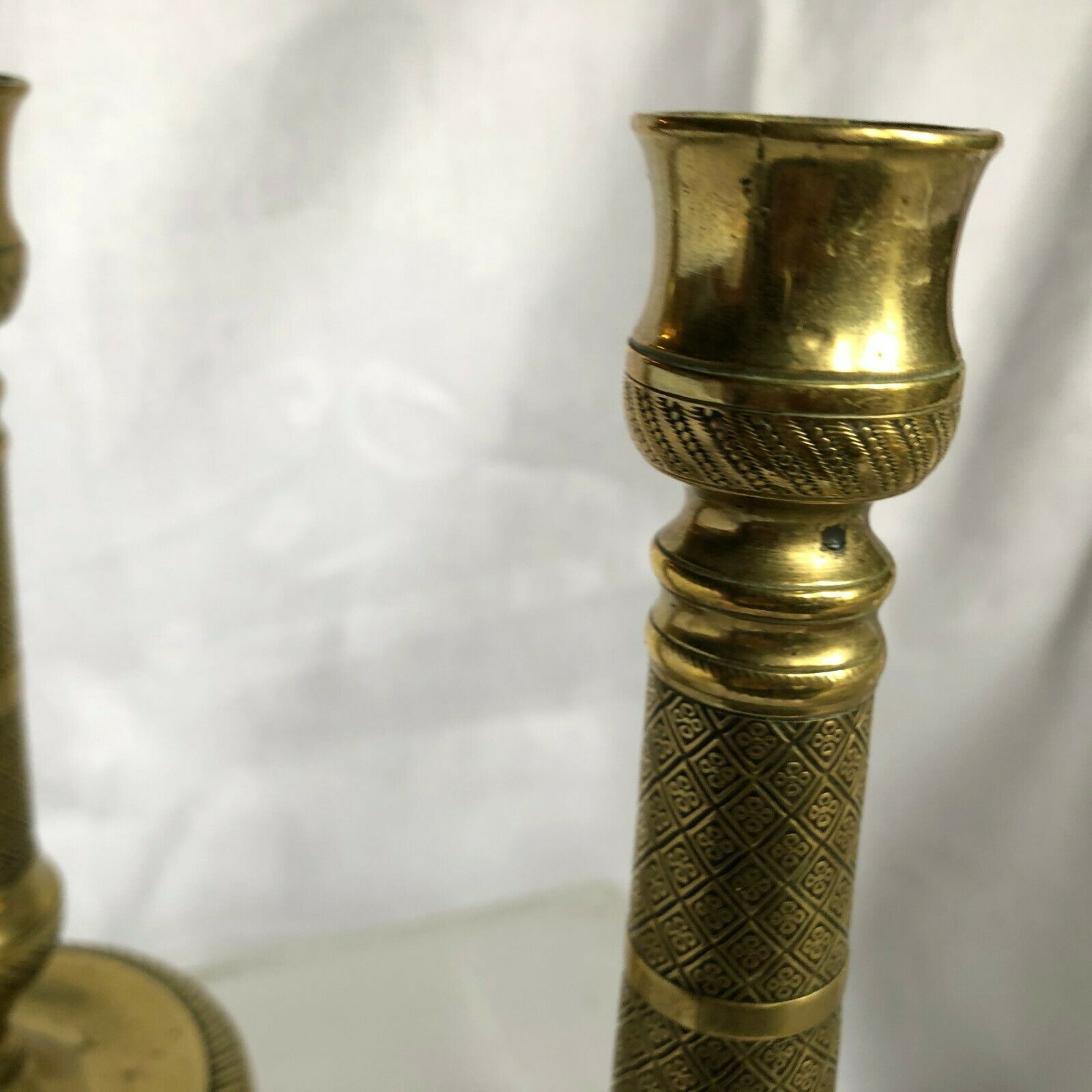 Pair of bronze and brass candlesticks