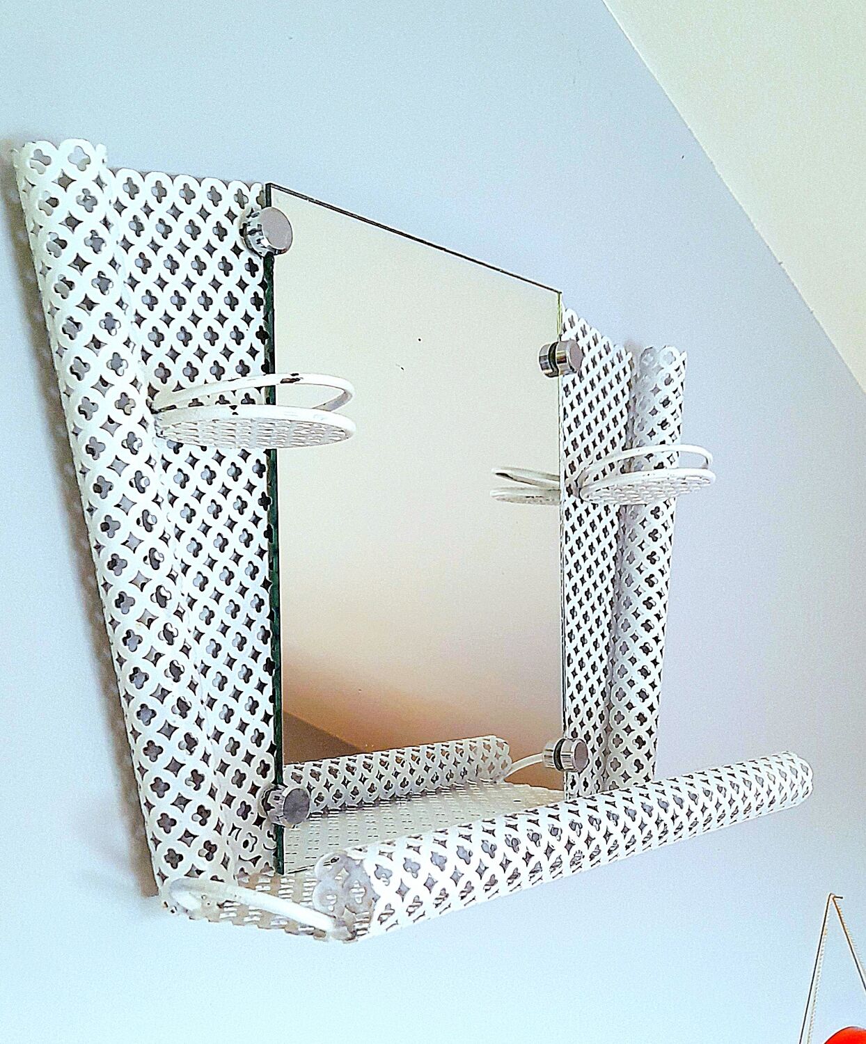 Perforated sheet metal bathroom shelf