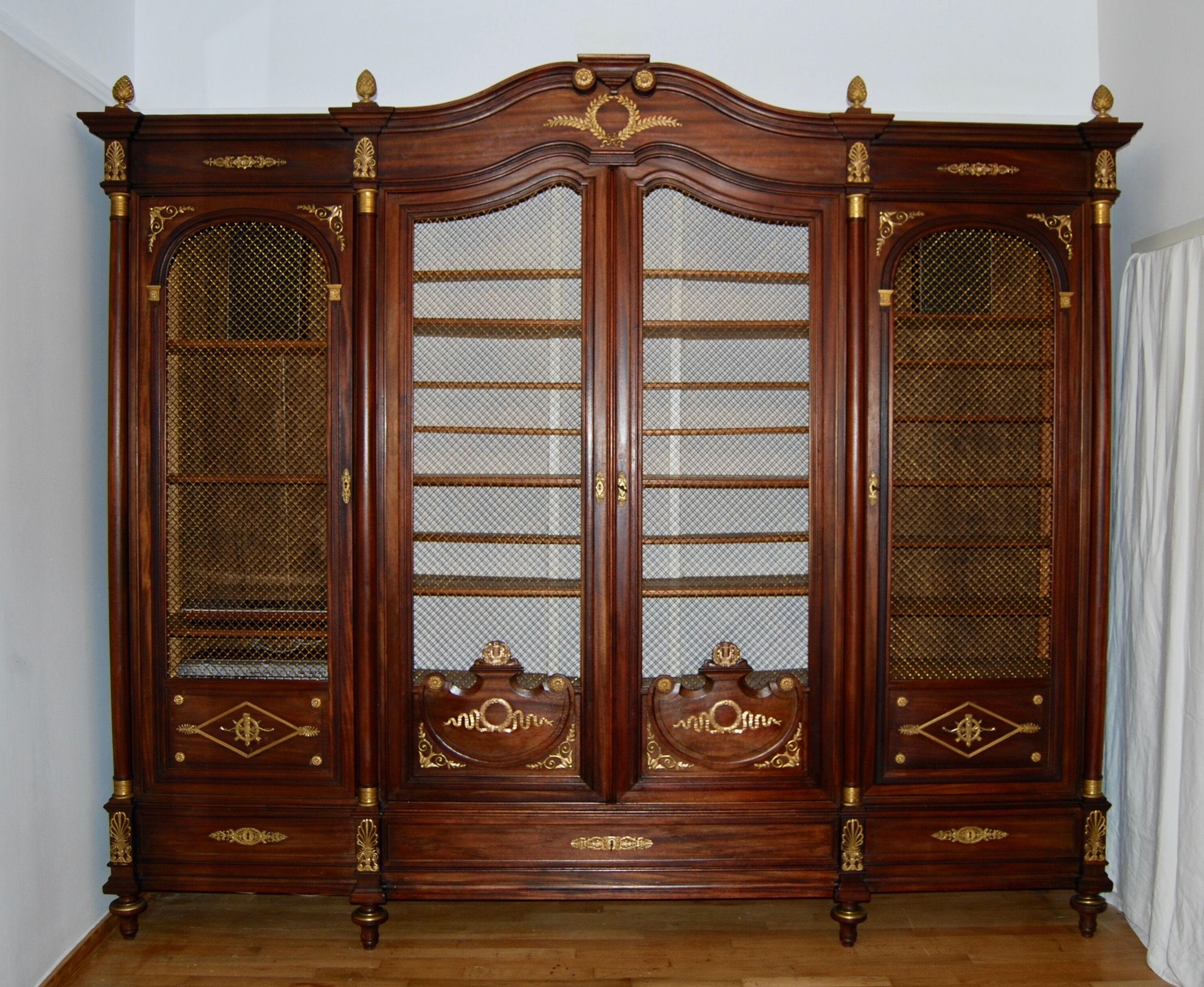 Large Empire library in solid mahogany, late nineteenth century
