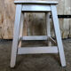 Vintage white wood milking stool