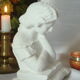 Limestone bust young girl who reads