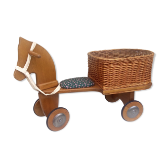 Vintage wheeled horse and his wicker basket