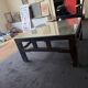 Vintage brutalist coffee table with Asian decor.