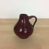 Red ceramic vase with handle