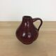 Vase en céramique rouge avec anse