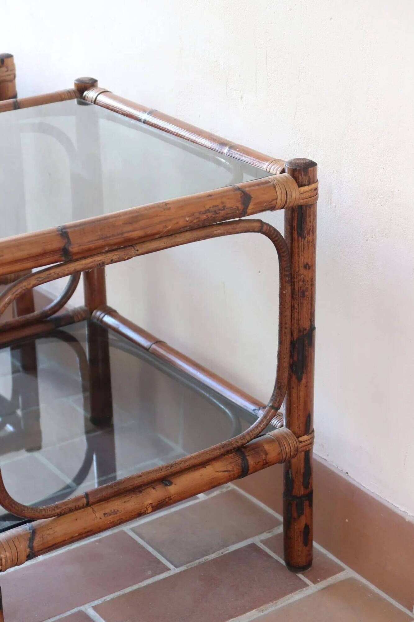Pair of bamboo and rattan bedside tables, smoked glass tops.