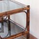 Pair of bamboo and rattan bedside tables, smoked glass tops.