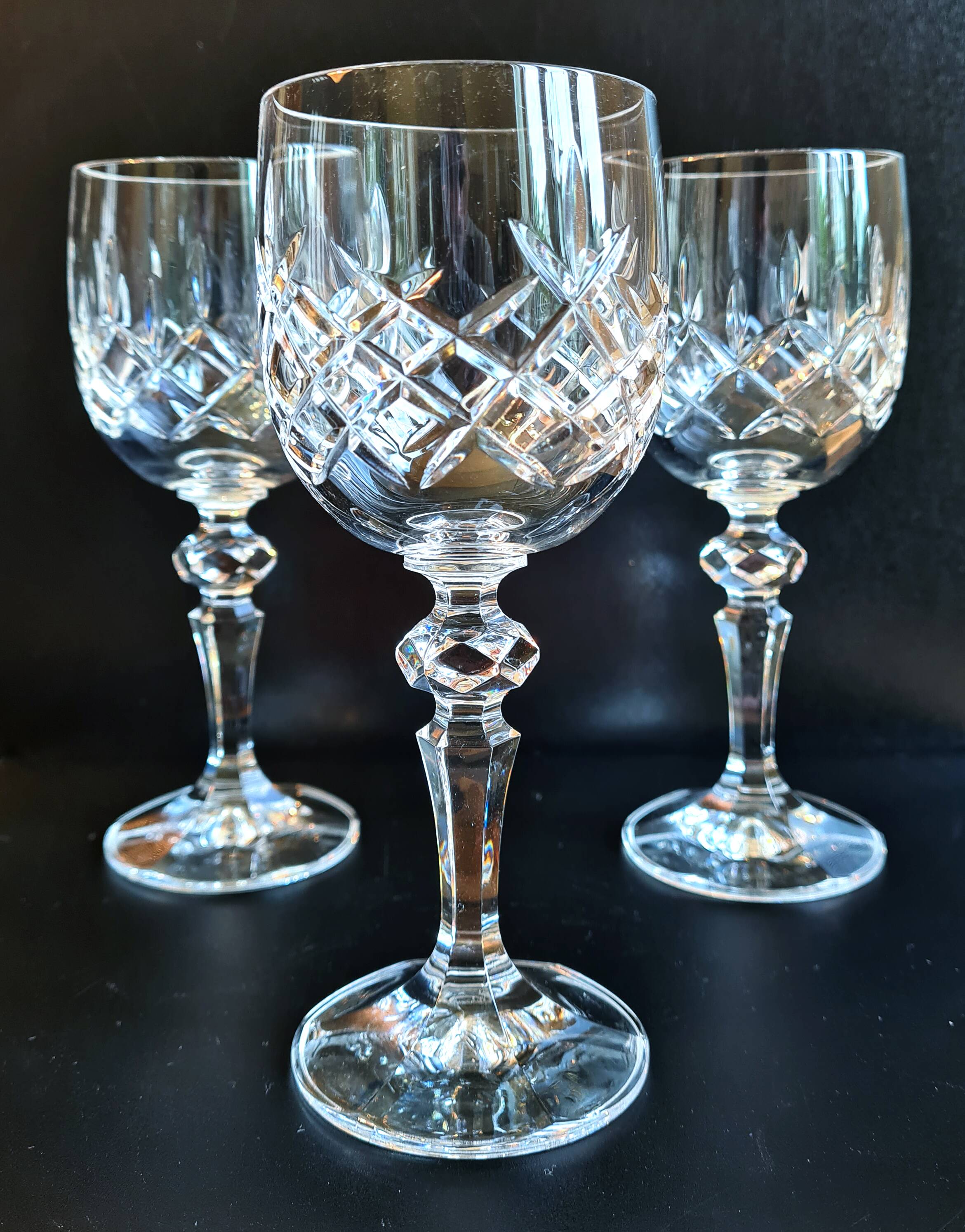 Set of three cut Bohemian Crystal Stemmed Glasses.