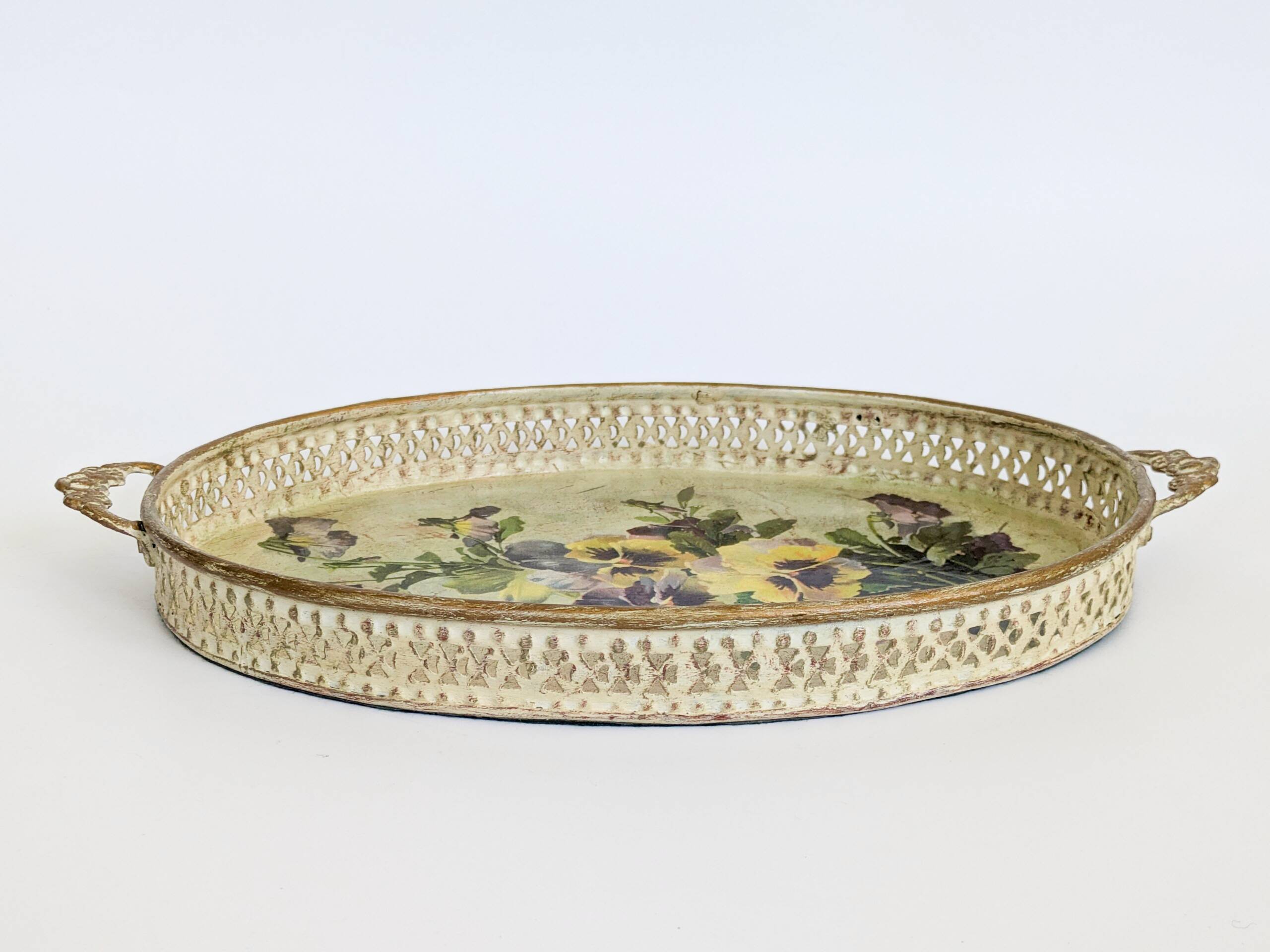 Oval metal decorative vintage tray with floral pattern.