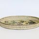 Oval metal decorative vintage tray with floral pattern.