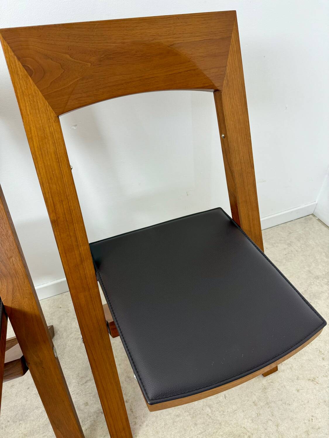 2 old folding chairs in wood and leather, postmodern design from the 80s vintage
