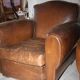 Lot de 2 fauteuils club en cuir années 50