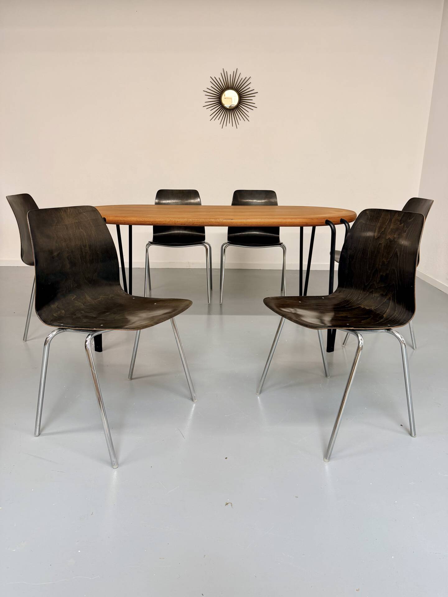 Solid wood dining table with tubular legs, 1980s postmodern design.