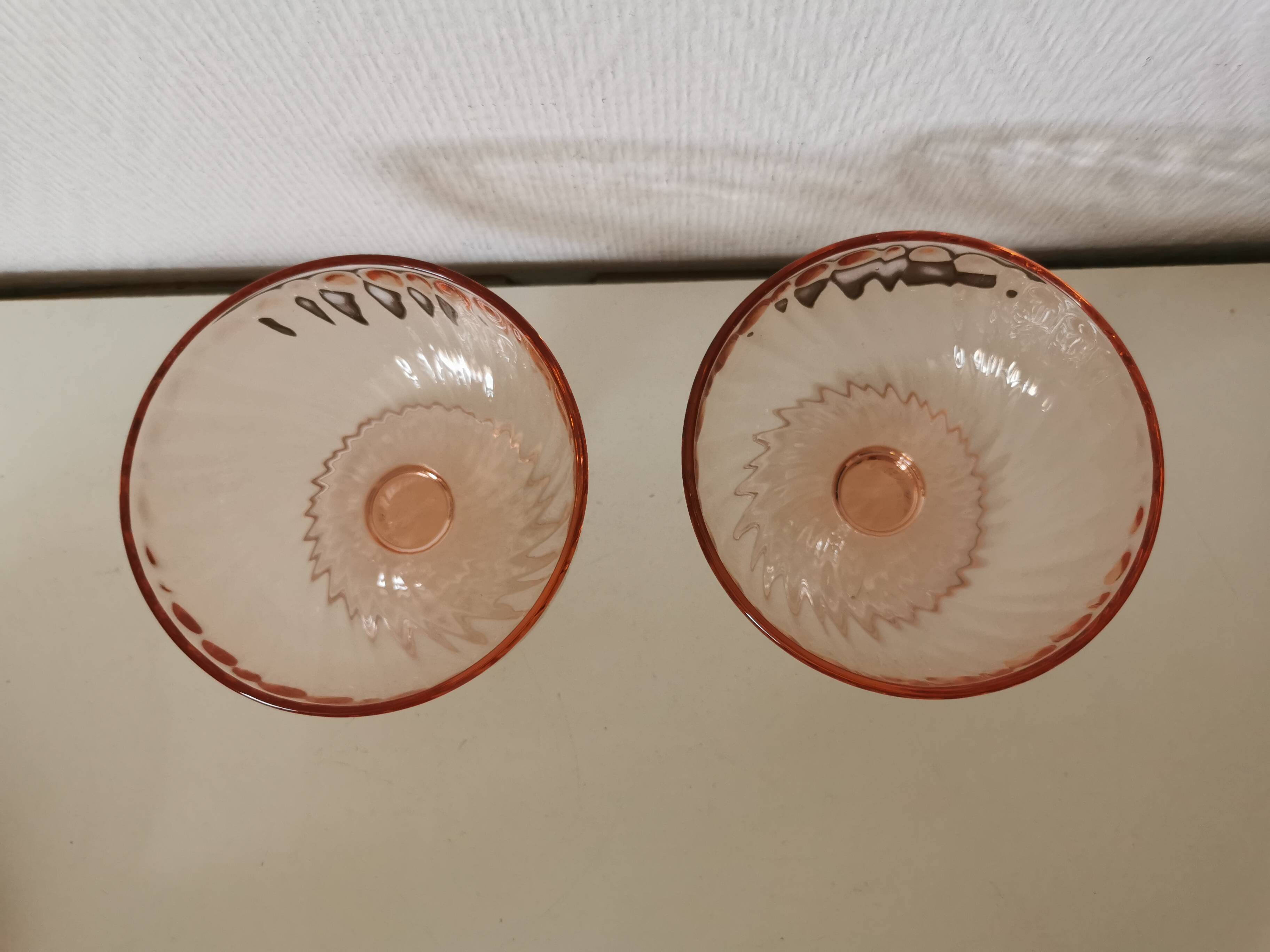 Pair of pink rosaline swirl glass fruit bowls