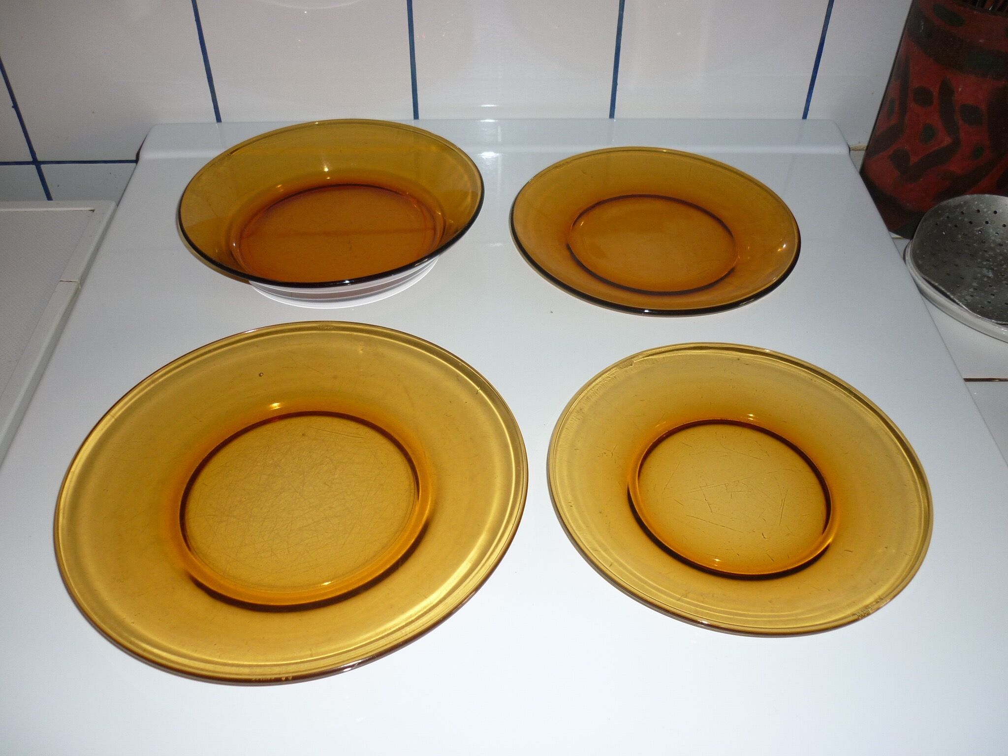Lot of 4 mismatched plates amber glass