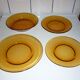 Lot of 4 mismatched plates amber glass