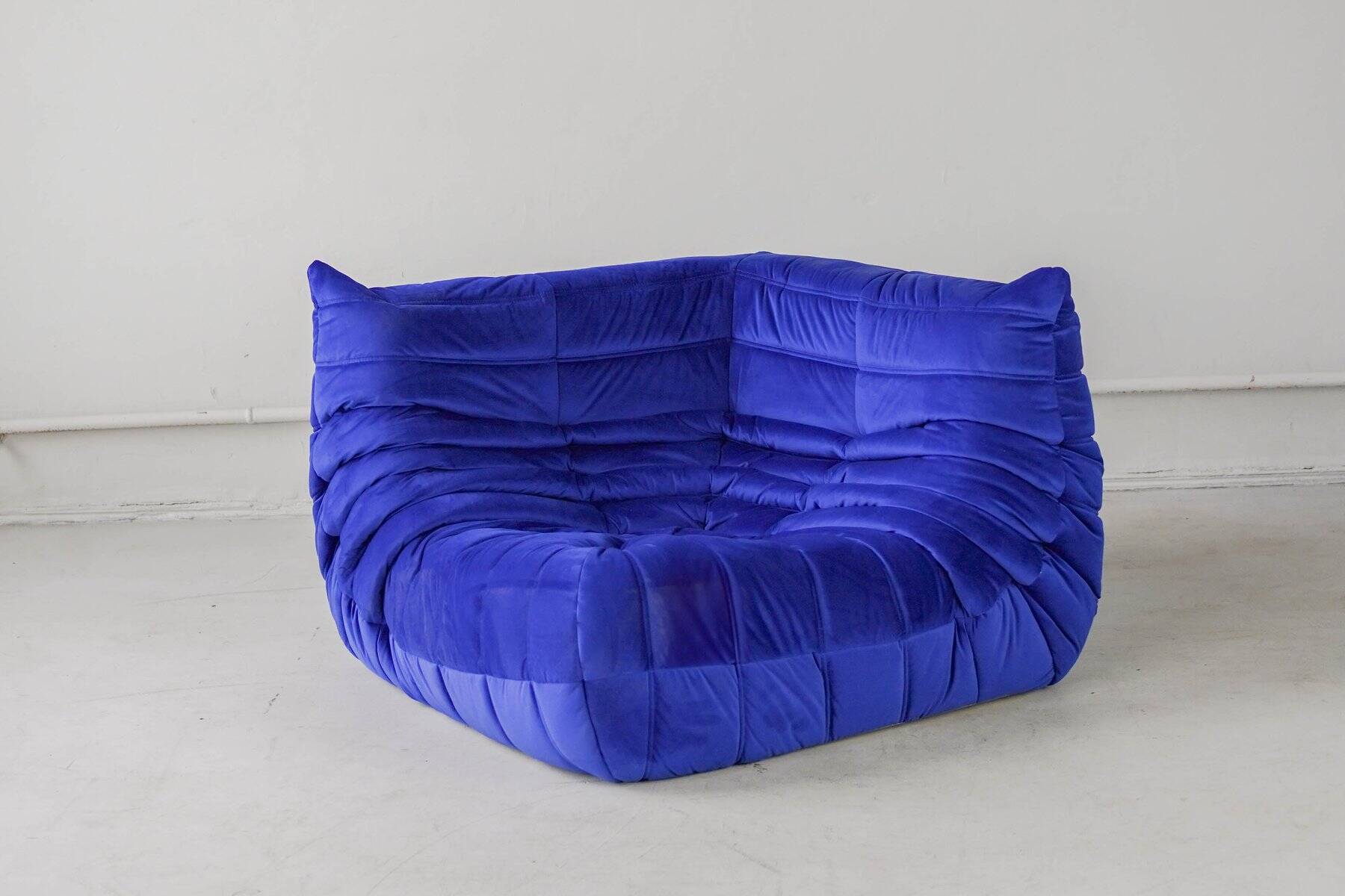 Togo corner chair in blue velvet by Michel Ducaroy for Ligne Roset