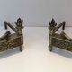 Pair of Empire Period Chenets in Chiselled Bronze with Torches and Leaf Frieze