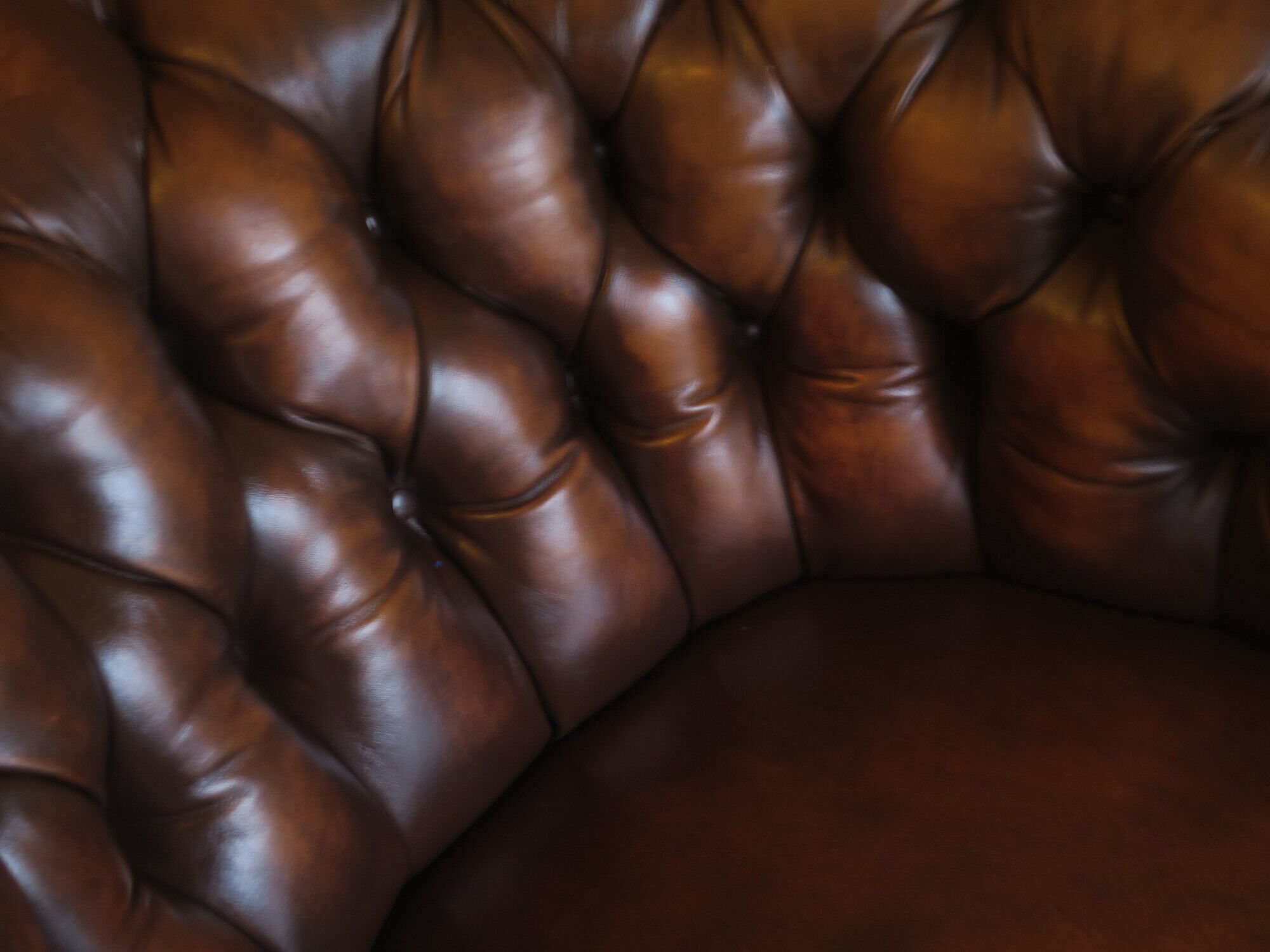 Chesterfield club armchair in patinated chestnut coloured leather
