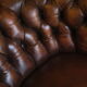 Chesterfield club armchair in patinated chestnut coloured leather