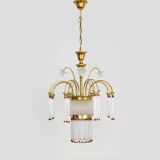 Art Nouveau style chandelier in brass with pendants and glass globe with 3 lights. Italy 70s 80s