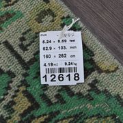 Vintage green and olive Turkish rug with a medallion, hand-knotted, 160 x 262 cm.