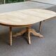 Large round extendable dining table renovated in raw pine with 2 extensions, 1980.