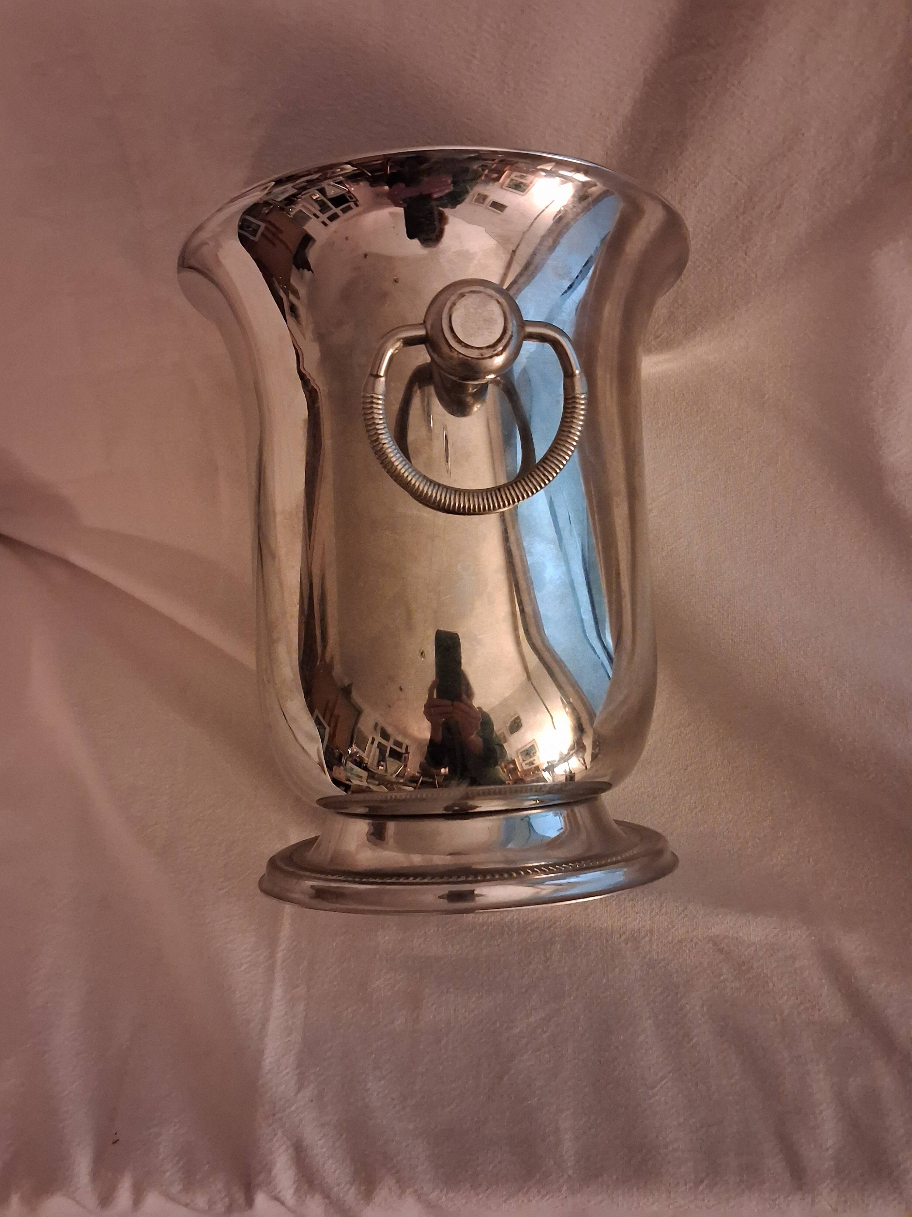 Stainless steel champagne bucket, silversmith Jean Couzon, model on a pedestal.