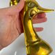 Pair of brass bookends in the shape of a duck's head, 1970.