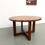 Modernist round table in solid elm, crossed legs.