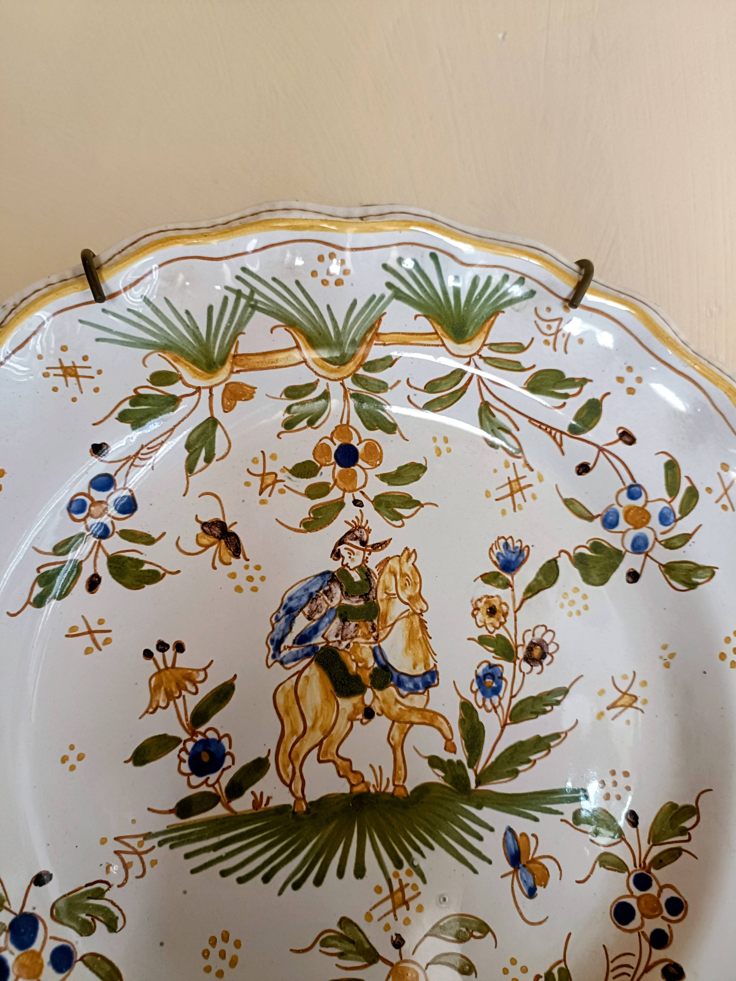 Antique Moustiers plate hand-decorated with a horseman.