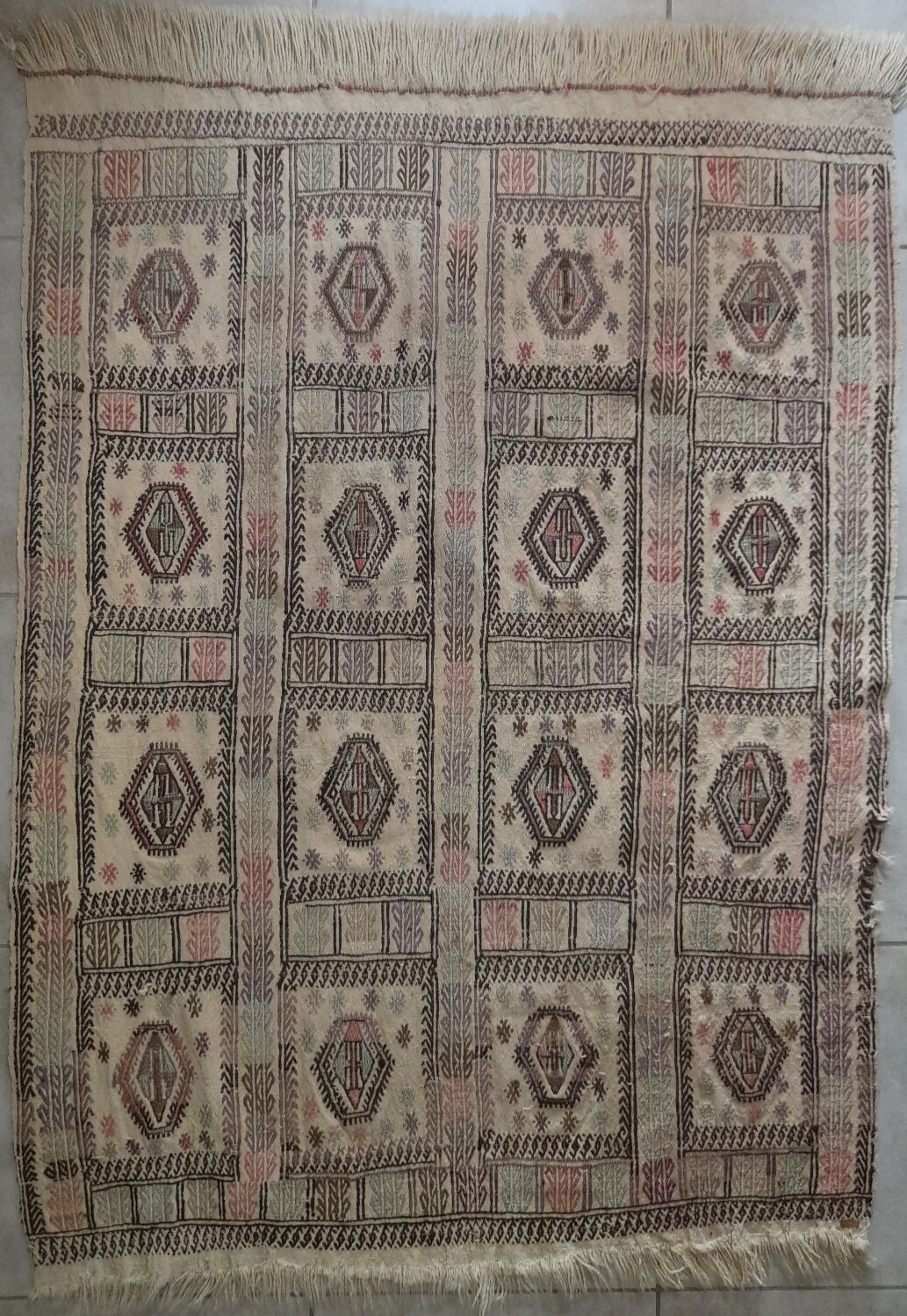 Antique embroidered kilim with 16 medallions from Turkey or the Balkans, c. 1950.