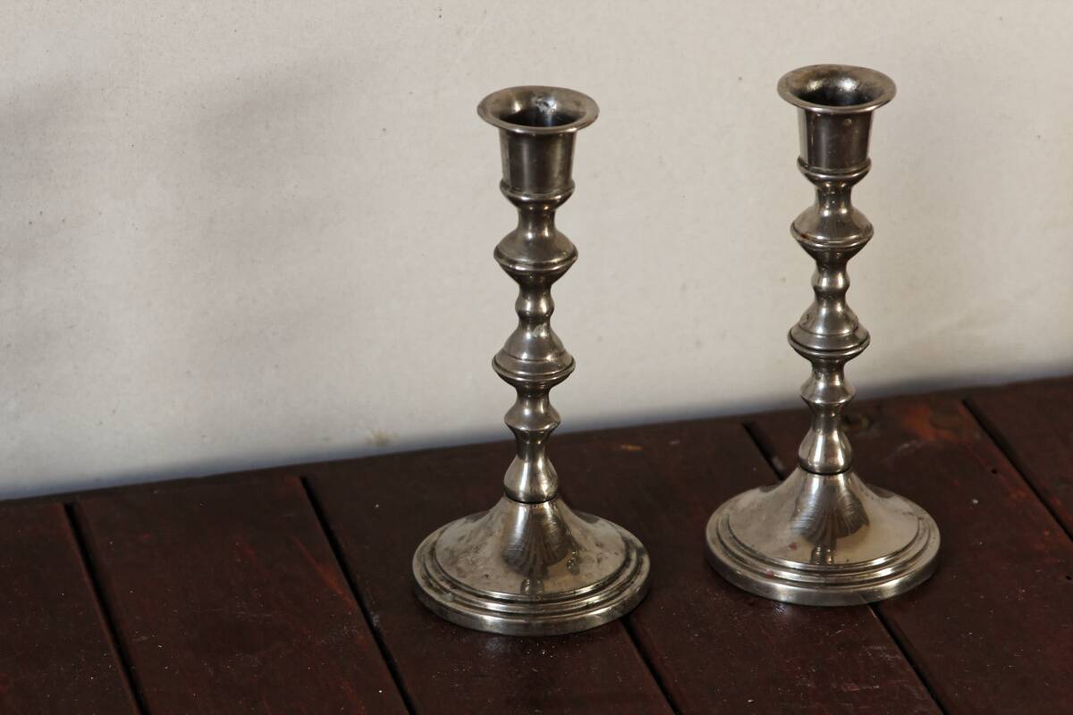 Pair of silver metal candlesticks