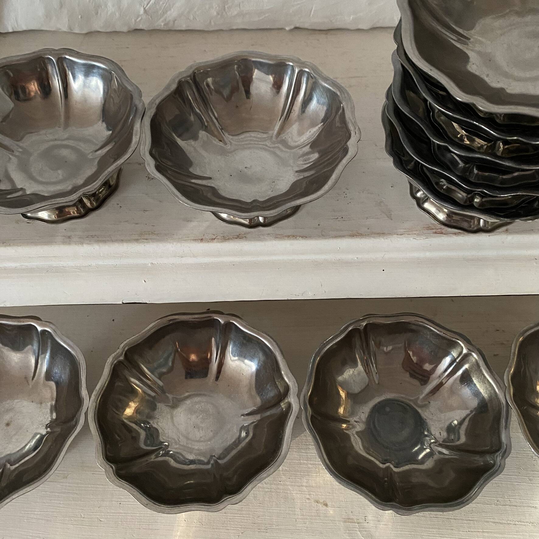 Stainless steel ice cream bowls for one scoop.