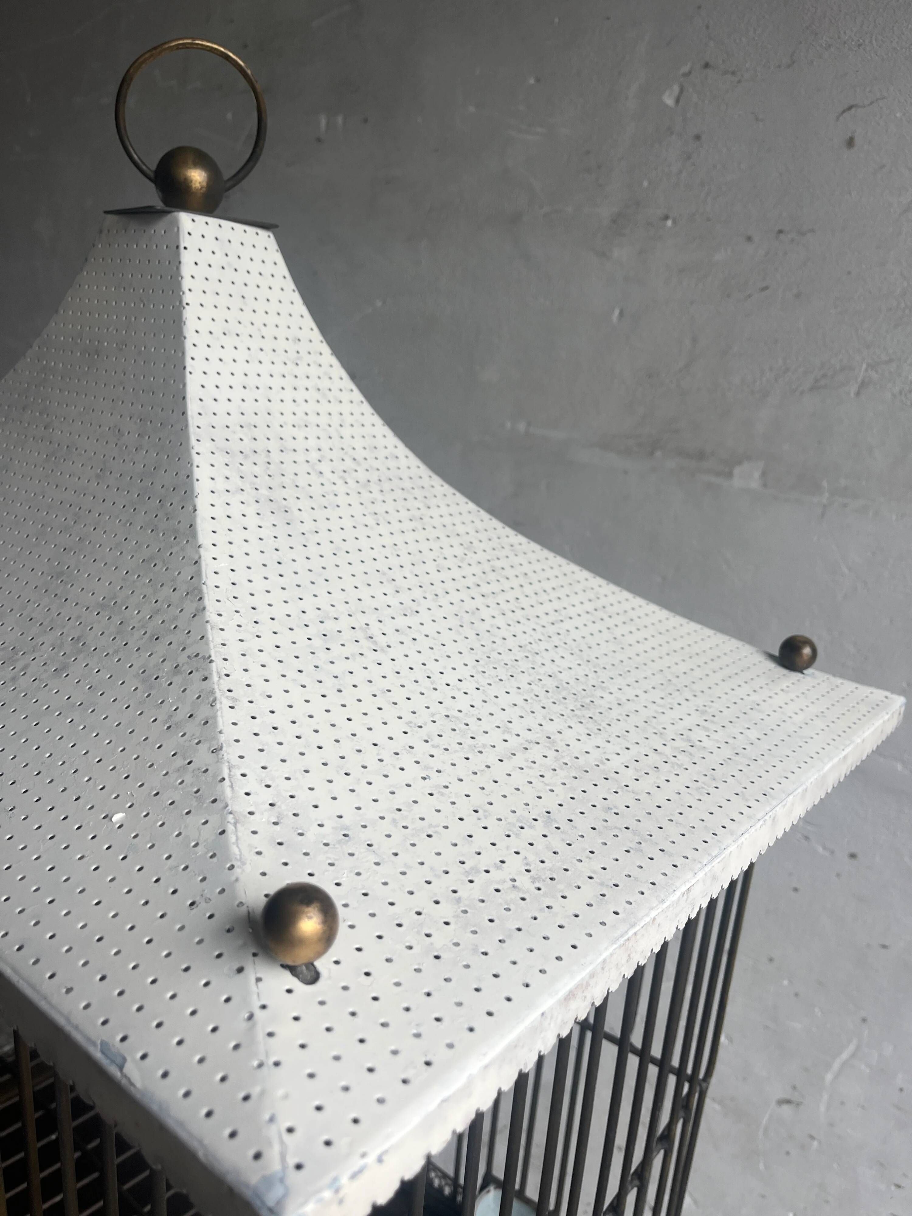 Vintage pagoda-style birdcage on a stand